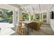 A covered patio with a wicker seating, bar, a ceiling fan and a view of the pool at 3086 E Pine Valley Nw Rd, Atlanta, GA 30305
