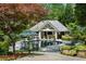 Beautiful pool area with lush landscaping and a pool house at 3086 E Pine Valley Nw Rd, Atlanta, GA 30305