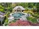 Aerial view of pool with pool house, landscaping, and outdoor seating at 3086 E Pine Valley Nw Rd, Atlanta, GA 30305