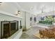 Relaxing porch with white brick fireplace, rattan seating, and comfortable swing at 3086 E Pine Valley Nw Rd, Atlanta, GA 30305
