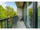 Relaxing outdoor balcony with a comfortable chair overlooking lush greenery at 480 John Wesley Dobbs Ne Ave # 418, Atlanta, GA 30312
