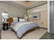 Comfortable bedroom features modern decor, exposed concrete wall, neutral colors, and a large window with natural light at 480 John Wesley Dobbs Ne Ave # 418, Atlanta, GA 30312