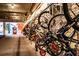 Indoor bike storage and repair area with a wall of bikes hanging on racks for residents to use at 480 John Wesley Dobbs Ne Ave # 418, Atlanta, GA 30312