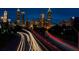 Night view of Atlanta skyline with bright lights and traffic trails on the highway at 480 John Wesley Dobbs Ne Ave # 418, Atlanta, GA 30312