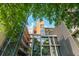 Modern apartment building featuring large windows and balconies, surrounded by lush greenery at 480 John Wesley Dobbs Ne Ave # 418, Atlanta, GA 30312