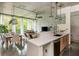 Open-concept living space with modern kitchen, dining area, and balcony access with scenic views at 480 John Wesley Dobbs Ne Ave # 418, Atlanta, GA 30312