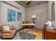 Bright office space features concrete walls, mid-century modern furniture, colorful decor, and natural light at 480 John Wesley Dobbs Ne Ave # 418, Atlanta, GA 30312