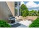 Outdoor patio area with a grill, benches, and lush greenery, perfect for relaxing or entertaining at 480 John Wesley Dobbs Ne Ave # 418, Atlanta, GA 30312