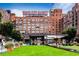 Exterior view of Ponce City Market with open green space, walking paths, and seating at 480 John Wesley Dobbs Ne Ave # 418, Atlanta, GA 30312