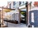 Modern restaurant entrance with glass door, exposed brick, and outdoor seating area at 480 John Wesley Dobbs Ne Ave # 418, Atlanta, GA 30312