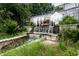 Beautiful outdoor water feature with landscaping including an upper wall and lower tier cascading waterfall at 480 John Wesley Dobbs Ne Ave # 418, Atlanta, GA 30312