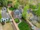 A stunning aerial view of a beautifully landscaped property with mature trees and well-maintained lawns at 603 E Paces Ferry Ne Rd, Atlanta, GA 30305