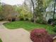 Expansive backyard featuring lush green grass and mature trees, offering a serene and private outdoor space at 603 E Paces Ferry Ne Rd, Atlanta, GA 30305