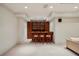 Finished basement with custom bar featuring wood cabinets, lighting, and seating at 603 E Paces Ferry Ne Rd, Atlanta, GA 30305