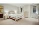 Comfortable bedroom with a bed, dresser, and windows overlooking the property at 603 E Paces Ferry Ne Rd, Atlanta, GA 30305