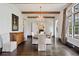 Formal dining room with a chandelier, wooden beams, and large windows at 603 E Paces Ferry Ne Rd, Atlanta, GA 30305
