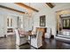 Bright dining area featuring dark hardwood floors, a chandelier, and access to other rooms at 603 E Paces Ferry Ne Rd, Atlanta, GA 30305