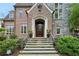 Inviting front entrance with stone steps, a classic wood door, and well-maintained landscaping at 603 E Paces Ferry Ne Rd, Atlanta, GA 30305
