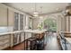 Modern kitchen with stainless steel appliances, a marble island, and custom cabinetry at 603 E Paces Ferry Ne Rd, Atlanta, GA 30305