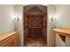 Charming wine cellar with custom wood racks and brick flooring for storing your favorite vintages at 603 E Paces Ferry Ne Rd, Atlanta, GA 30305
