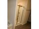 Bathroom featuring a glass-door shower and tub at 6348 Lanier Harbor Lndg, Buford, GA 30518