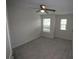A spacious bedroom with two windows and carpet flooring at 6348 Lanier Harbor Lndg, Buford, GA 30518
