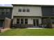 Backyard view with a small patio featuring a seating area at 6348 Lanier Harbor Lndg, Buford, GA 30518