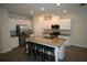 Kitchen boasts granite countertops, stainless steel appliances, and an island at 6348 Lanier Harbor Lndg, Buford, GA 30518
