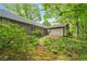 Backyard view of home with brick path and greenery at 258 Lancaster Cir, Marietta, GA 30066