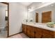 Classic bathroom featuring a spacious vanity, large mirror, and ample cabinet space at 258 Lancaster Cir, Marietta, GA 30066