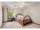 Bedroom featuring a ceiling fan, window views, neutral carpet and light walls at 258 Lancaster Cir, Marietta, GA 30066