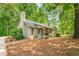 Traditional home with a long front porch surrounded by lush greenery at 258 Lancaster Cir, Marietta, GA 30066