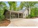 Charming home with a covered parking area and lush landscaping, perfect for outdoor living at 258 Lancaster Cir, Marietta, GA 30066