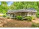 Classic home with a covered front porch, surrounded by a well-manicured lawn at 258 Lancaster Cir, Marietta, GA 30066