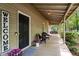 Inviting front porch with a welcome sign, seating and colorful flowers at 258 Lancaster Cir, Marietta, GA 30066