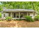 Charming front porch featuring a welcome sign, rocking chair, and ample seating at 258 Lancaster Cir, Marietta, GA 30066
