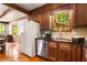 Kitchen featuring stainless steel appliances, wood cabinets, granite counters, and wood floors at 258 Lancaster Cir, Marietta, GA 30066
