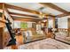 Open-concept living room with a brick fireplace, exposed beams, hardwood floors and plenty of seating at 258 Lancaster Cir, Marietta, GA 30066