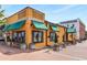Bright and inviting restaurant exterior with outdoor seating and vibrant signage at 258 Lancaster Cir, Marietta, GA 30066