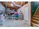 Spacious unfinished basement with exposed ceiling and stairs at 2903 Southpark Sw Ter, Conyers, GA 30094