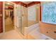 Bathroom featuring a shower, garden tub, and walk-in closet at 2903 Southpark Sw Ter, Conyers, GA 30094
