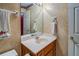 Bathroom featuring a single sink vanity, mirror, and decorative walls at 2903 Southpark Sw Ter, Conyers, GA 30094