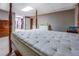 Bedroom featuring a large bed, ample natural light, and closet access at 2903 Southpark Sw Ter, Conyers, GA 30094