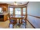 Lovely dining area with wood floors, a round table and large windows at 2903 Southpark Sw Ter, Conyers, GA 30094