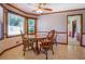 The dining room features wood floors and a round table with seating for four at 2903 Southpark Sw Ter, Conyers, GA 30094