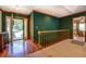 Inviting entryway with hardwood floors and striped wallpaper, featuring a view into the living spaces at 2903 Southpark Sw Ter, Conyers, GA 30094
