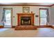 Charming brick fireplace flanked by windows, creating a cozy and inviting atmosphere at 2903 Southpark Sw Ter, Conyers, GA 30094
