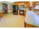 Spacious kitchen with wood cabinets, black appliances, and ample counter space at 2903 Southpark Sw Ter, Conyers, GA 30094