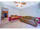 The living room has a cozy sofa, desk and a doorway leading to the kitchen at 2903 Southpark Sw Ter, Conyers, GA 30094