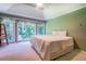 Bright bedroom with a tray ceiling, large windows and plush carpet at 2903 Southpark Sw Ter, Conyers, GA 30094